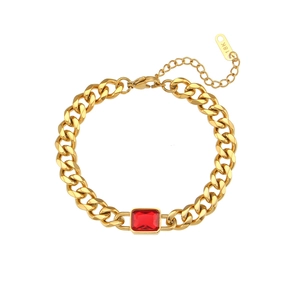 Detail of 18K gold plated Cuban chain bracelet with rectangular red zircon and lobster clasp