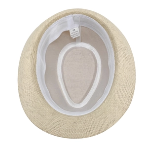 Detail view of straw hat interior showing white sweatband and 100% paper material label