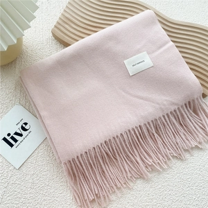 Thick solid light pink cashmere feel scarf with tassels and decorative woven label