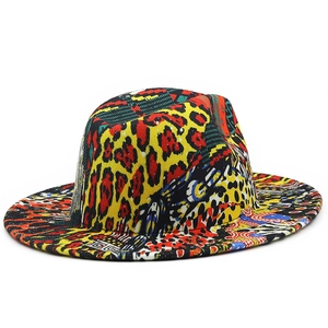 Close-up of vibrant leopard print and geometric patterns on a wide brim fedora hat