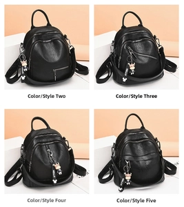 Four black PU leather backpacks with zipper pockets and cartoon cow charms displayed in a grid