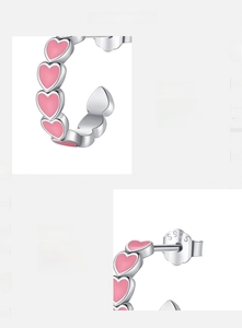 Macro detail of S925 sterling silver heart earrings with pink enamel finish and S925 hallmark
