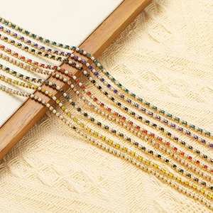 Detail of colorful rhinestone chains on golden metal base for DIY jewelry making