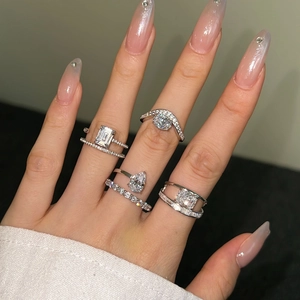 Elegant S925 sterling silver ring with emerald cut cubic zirconia on a female hand