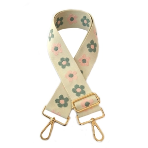 Adjustable beige embroidered bag strap with floral patterns and gold metal hooks