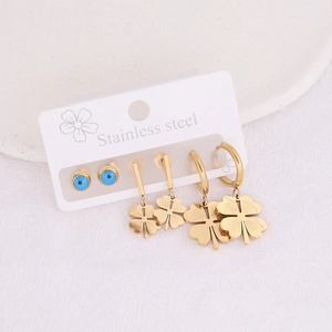 Gold stainless steel earring set featuring evil eye studs and clover dangles on card