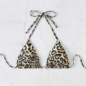 Flat lay of a leopard print triangle bikini top with adjustable halter neck ties