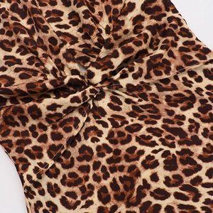 Detail view of the twisted leopard print fabric on a sexy deep V-neck backless dress
