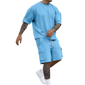 Detail of sky blue oversized men's summer t-shirt and cargo shorts sporty set