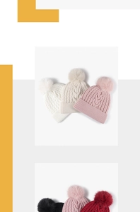 Close-up of thick cable knit texture and fluffy pom-poms on assorted winter beanies