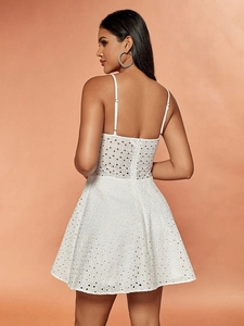 White cotton eyelet embroidery mini dress with adjustable straps and back zipper detail