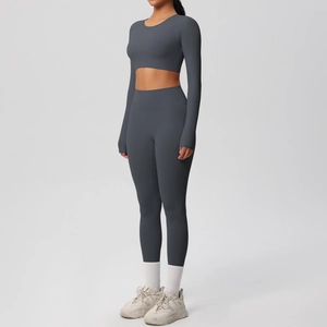 Charcoal grey seamless yoga set featuring a long sleeve crop top and high waist leggings