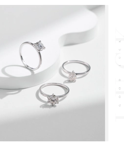 Detailed view of three s925 silver rings with round, pear, and square moissanite stones