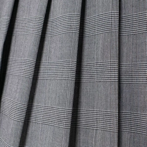 Women's pleated mini skirt in grey plaid pattern with premium fabric texture