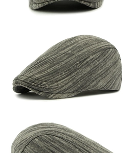Détail de la texture en coton sergé gris et des coutures d'une casquette plate