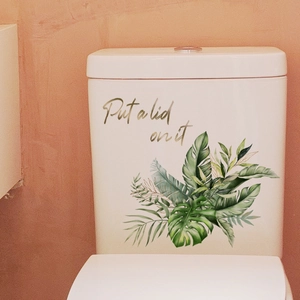 Green tropical leaf toilet tank sticker with 'Put a lid on it' artistic lettering