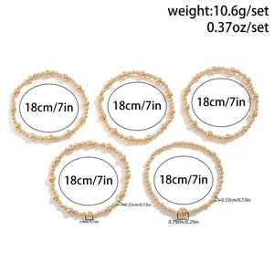 Detailed view of 5-piece bead bracelet set with heart pendant and size measurements