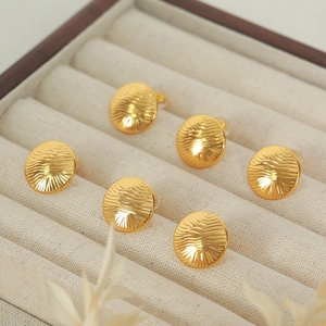 Elegant gold titanium steel earrings featuring a unique radial water ripple circular design