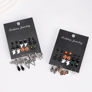 Halloween earring set with pumpkin, ghost, and bat designs on jewelry card