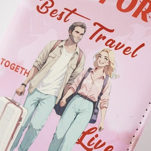 Close-up of pink leather passport holder with travel illustration and fine stitching