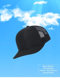 Detail of black trucker hat with breathable mesh and curved brim against blue sky