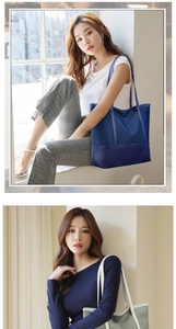 Detail of solid color Oxford cloth tote bags with contrasting leather straps in two colors