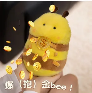 Close-up of cute plush bee holding a gold coin with a dollar sign for keychains