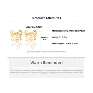 Detail view of bow pearl earrings with dimensions 3cm by 2.2cm and 8.6g weight