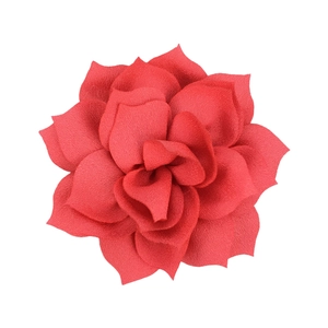 Macro detail of red layered fabric flower accessory with realistic petal texture