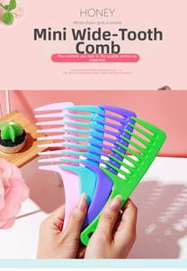 Macro shot of colorful mini wide-tooth combs for detangling wet curly hair easily