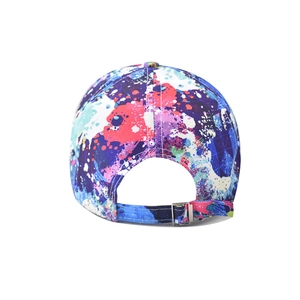 Close-up of adjustable metal buckle and vibrant paint splash graffiti pattern on baseball cap