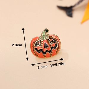 Detailed view of Halloween pumpkin brooch with orange enamel and sparkling rhinestones
