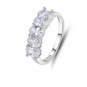Detail showing S925 hallmark on the silver band with five oval-cut clear cubic zirconia