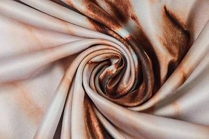 Close-up of the tie-dye pattern fabric with marble texture in brown, beige, and orange