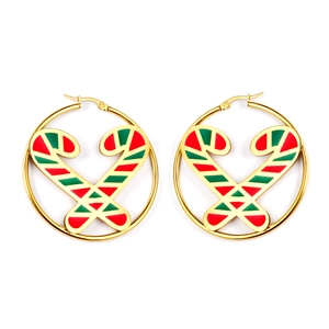 Christmas gold hoop earrings with red and green candy cane charm on white background