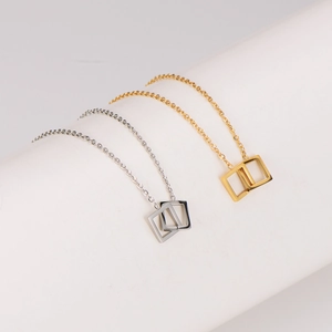 Elegant geometric interlocking square pendant necklace in gold and silver finish