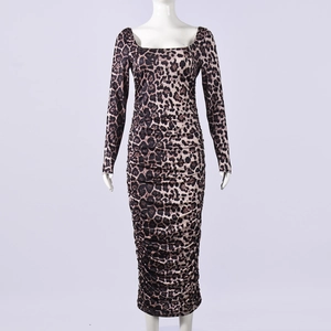 Detailed view of leopard print dress featuring square neck and elegant ruching textures
