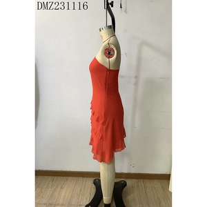 Close-up of red strapless mini dress featuring tiered ruffle layers in chiffon fabric