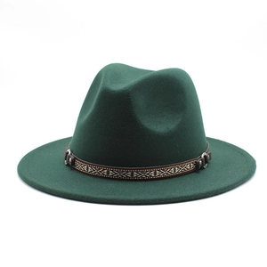 Detail of dark green cashmere wool fedora hat featuring an ethnic geometric pattern band