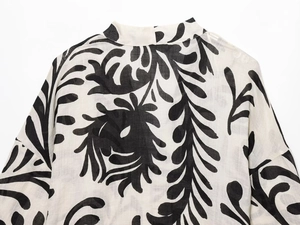 Detailed close-up of a leaf print kimono collar with premium woven fabric texture