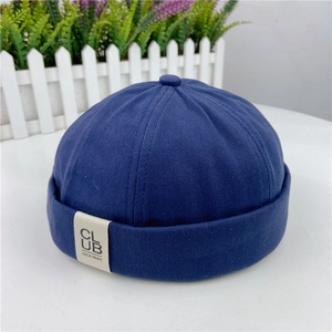 Navy blue docker hat in retro cotton canvas with a vintage side label and six-panel crown