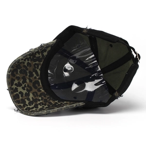 Distressed baseball cap with leopard print brim and embroidery detail on white background