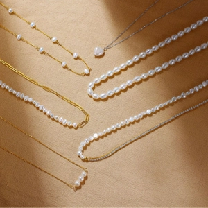 Elegant assortment of S925 sterling silver natural pearl necklaces with gold heart pendants