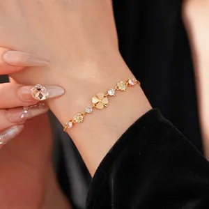 Gold-plated floral bracelet with yellow cat-eye stone and sparkling cubic zirconia stones