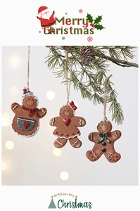 Three gingerbread man ornaments with realistic textures hanging on a festive pine branch
