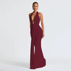 Detail of elegant backless halter neck maxi dress with a deep V-neck and mermaid hemline