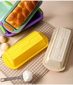 Close-up of silicone loaf pans with non-stick wavy texture and colorful handles for baking
