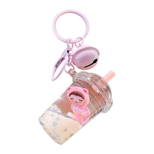 Pink quicksand cartoon bear keychain with milk tea cup design and metal bell on white base