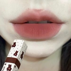 Matte bear lipstick in dusty rose shade showing a soft velvet finish on lips