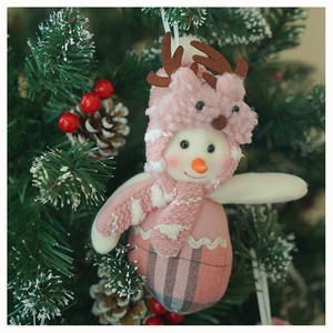 Detailed view of pink elk-themed plush snowman ornament hanging on a Christmas tree